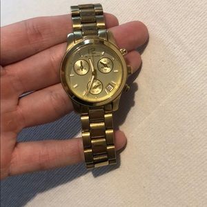 Michael lots gold watch